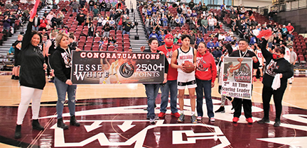 Issue9-BOYS DISTRICT Jessie White and family had a brief honoring after he sank the three pointer that put him in second place all time in ND high school scoring history -rev-web