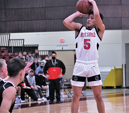 Issue9-BOYS DISTRICT Jessie White made this step back three pointer in a photo that captured a historic moment for White Shield -rev-web